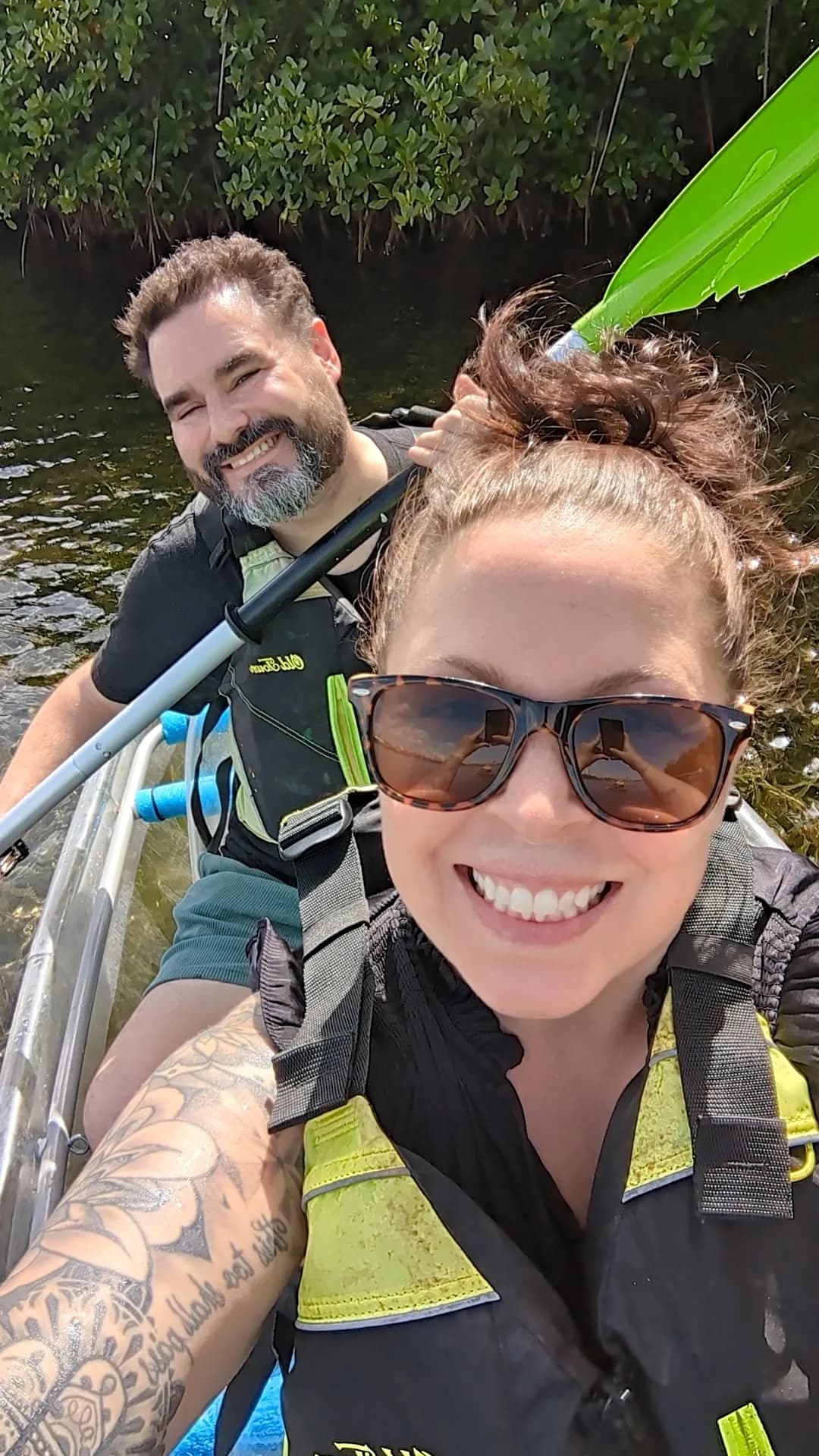 Tarin and her partner kayaking together on the river