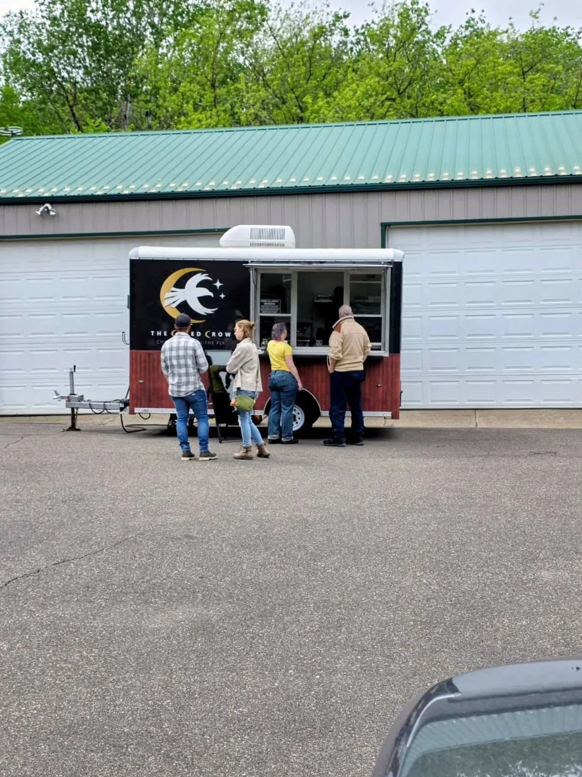 Customers gathered at the Cured Crow charcuterie trailer