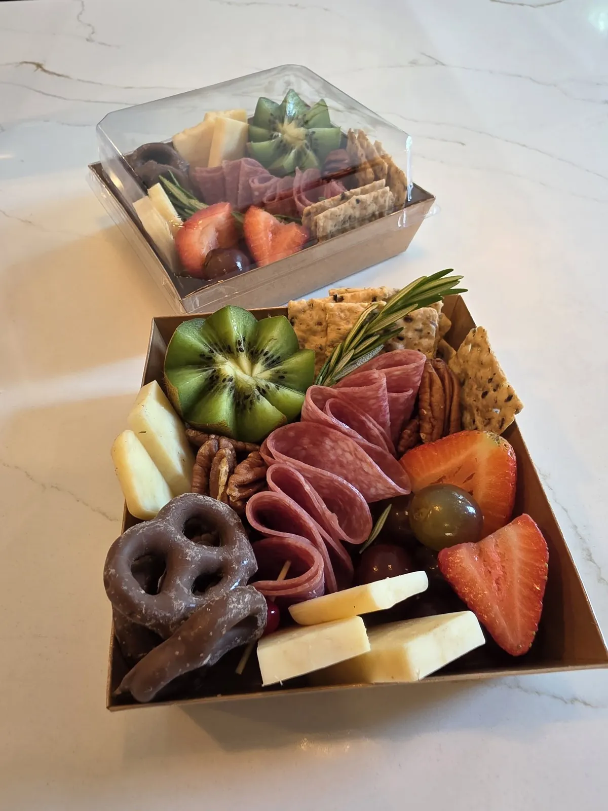 The Cured Crow's Nest Box grazing box filled with cheeses, cured meats, nuts and sweet treats