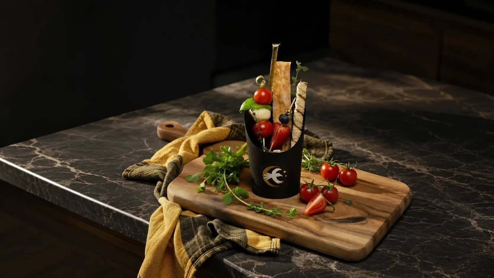 A single Cured Crow charcuterie cup beside a full grazing board